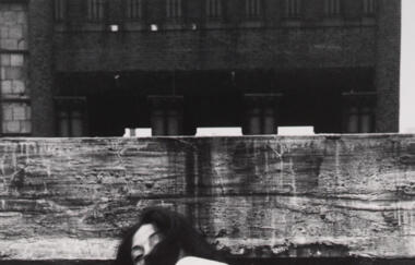 Wilke So Help Me Hannah 1978 squatting looking back hair on face gun 1